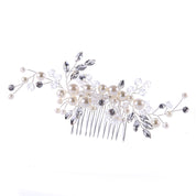 Decorative hair comb with pearls and crystals on a white background