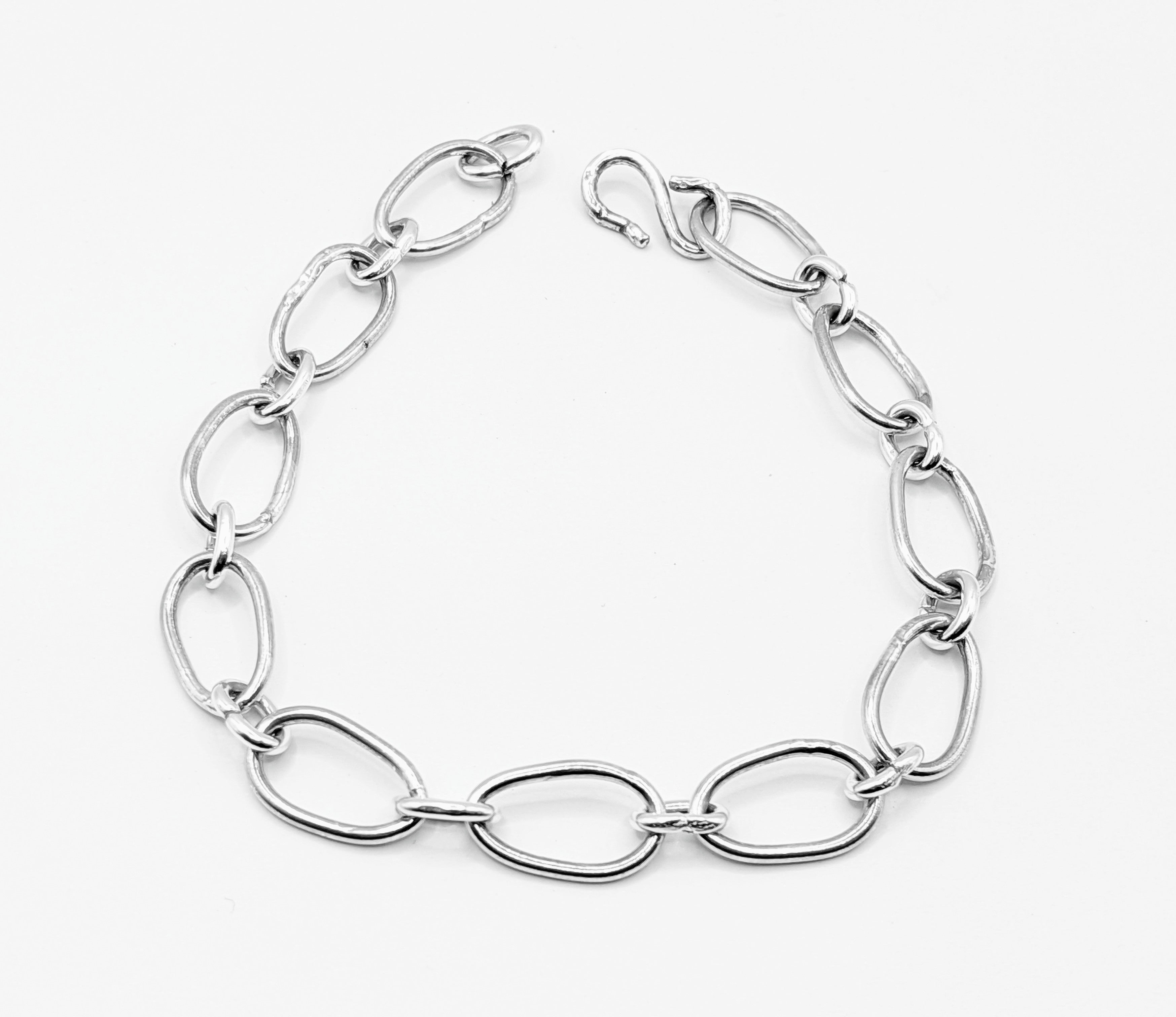 Radiant Linkage: Handcrafted Sterling Silver Oval Chain Bracelet