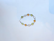 Full view of Here Comes Spring citrine peridot and clear quartz bracelet