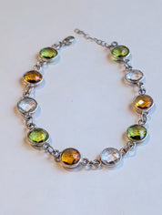 Close detail of citrine peridot and clear quartz bracelet in sterling silver