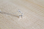 Standing Reindeer Figurine Necklace in Sterling Silver