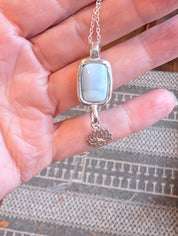Night Lotus necklace with blue opal and lotus charm in sterling silver