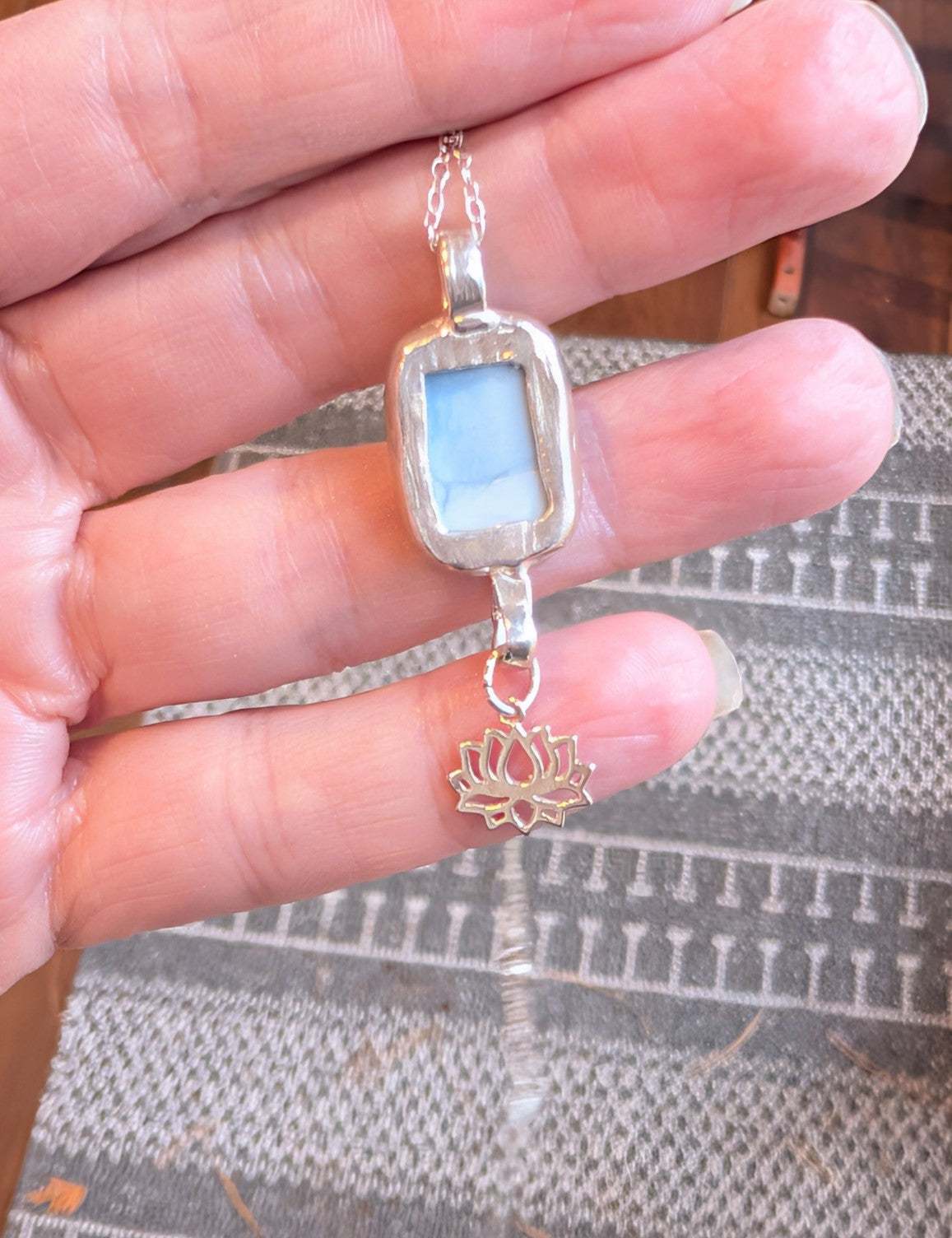 Blue opal sterling silver necklace with lotus charm detail