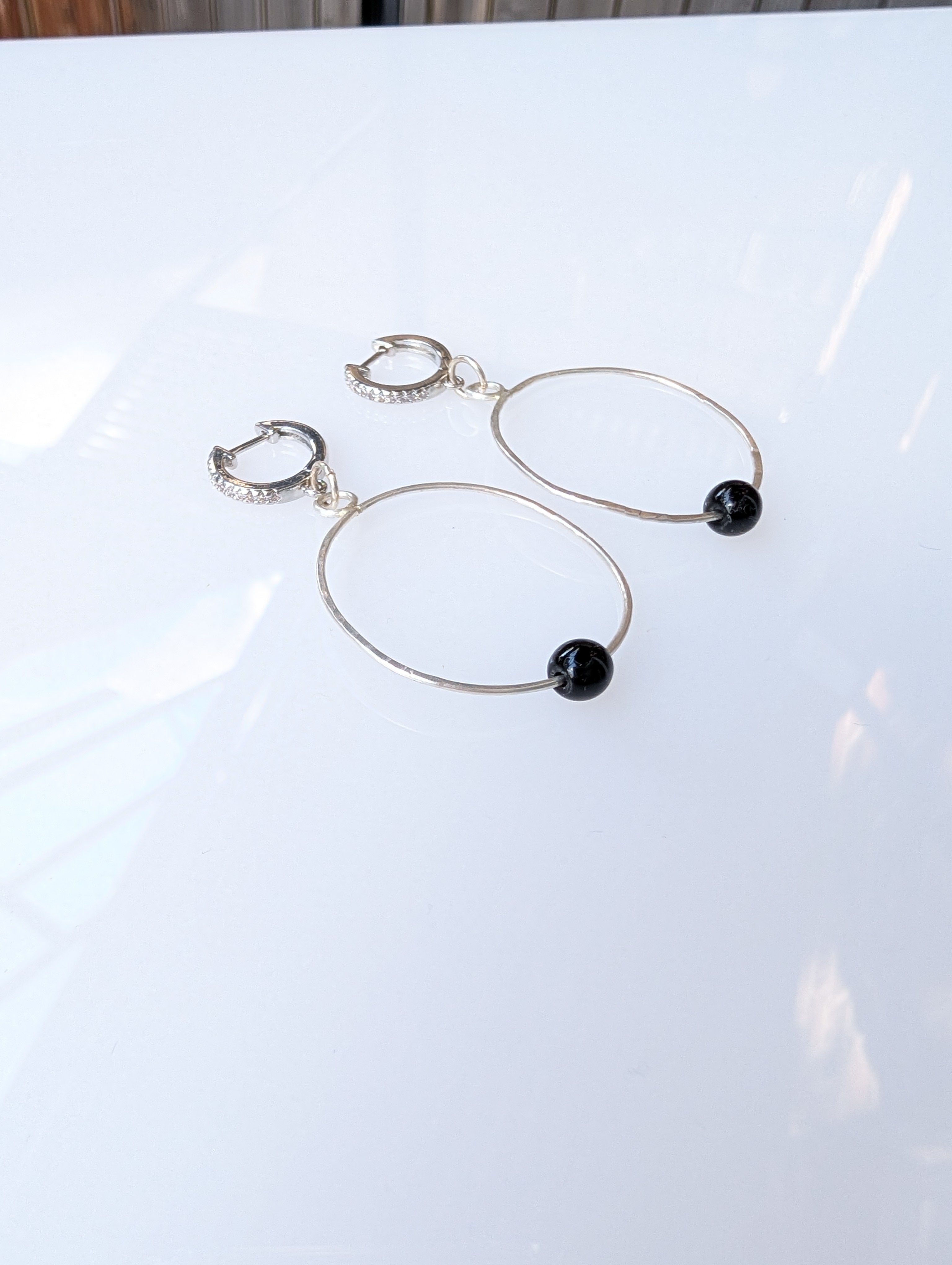 Night Current Hoops | Sterling silver hoop earrings with black spinel • The Night Sea Collection